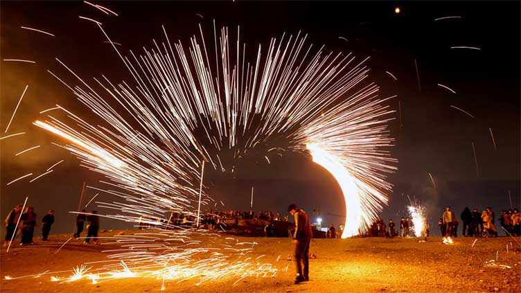 Iranians celebrate fire festival, hoping to remedy 'all problems'