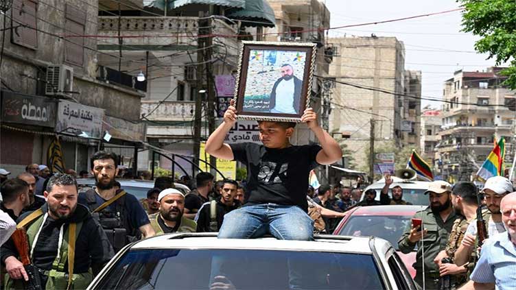 Syrian Druze leader slams 'genocidal campaign', Israel issues warning