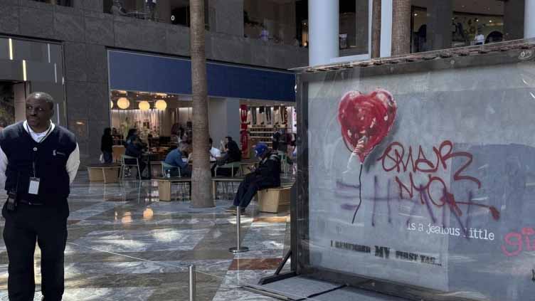 Banksy's 'Broken Heart' painting defaced on a Brooklyn wall is up for sale