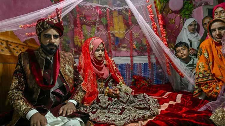 'We don't care': weddings go on in Pakistan's Kashmir border