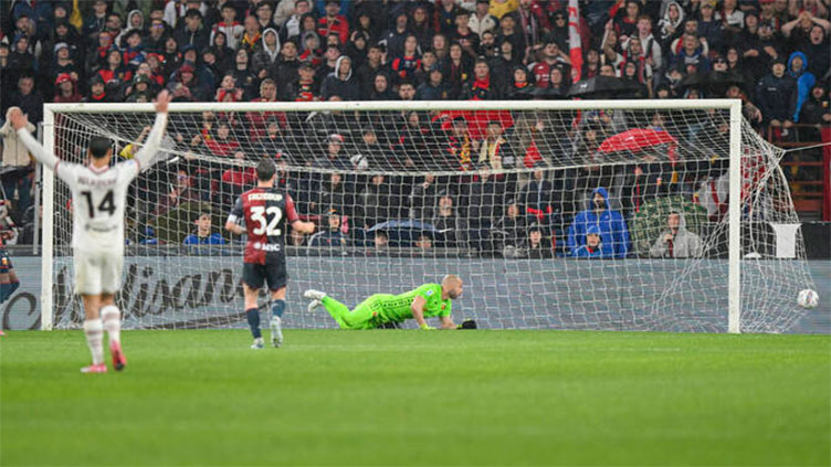 Milan clinch 2-1 win with two quick-fire goals in rainy Genoa clash