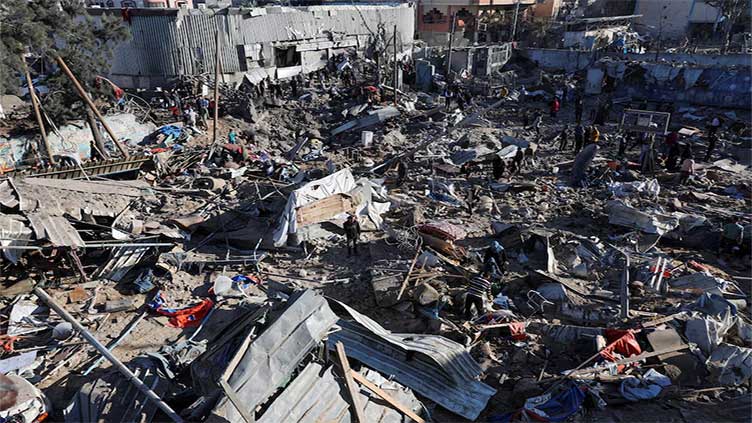 Israeli strikes kill 13 in Gaza school housing displaced families, medics say