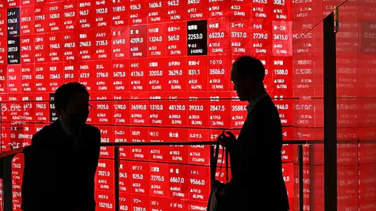 Japanese stocks jump, dollar firms on trade hopes