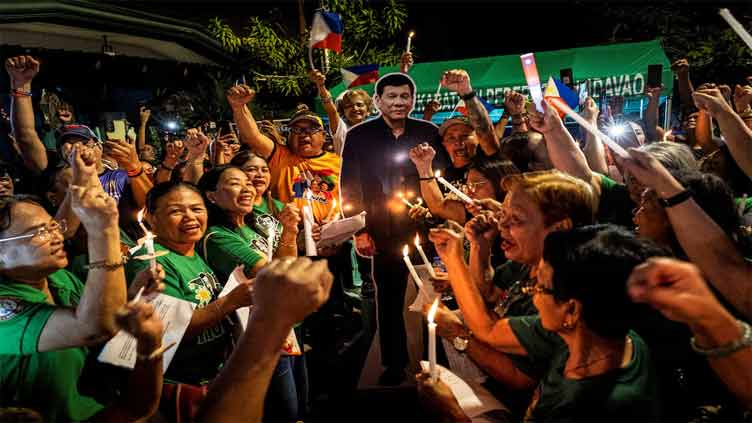In custody in the Hague, on ballot at home: Philippines' Duterte runs for mayor