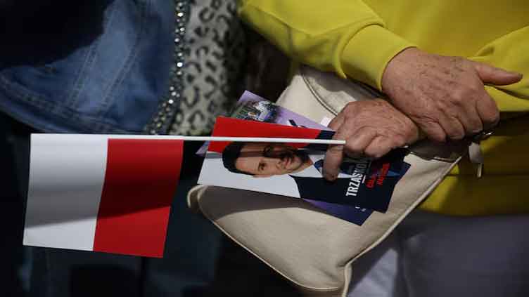 Polish presidential election frontrunner faces scrutiny over ads