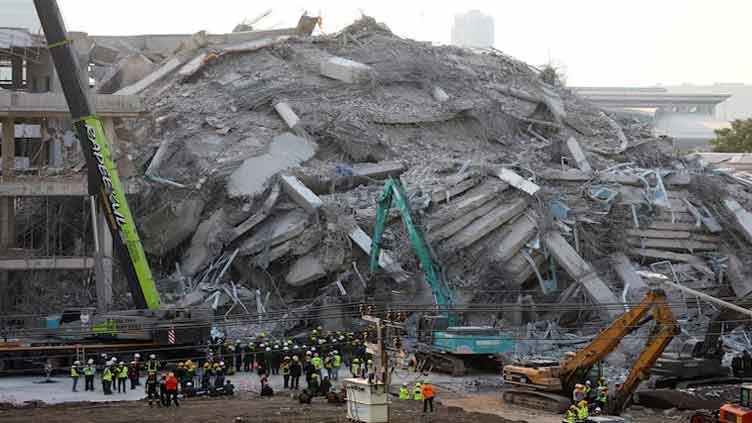Thai construction tycoon and 14 others surrender to police over fatal Bangkok tower collapse