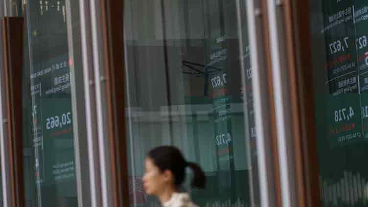 Asia shares slip on mixed China data, drop in Wall St futures