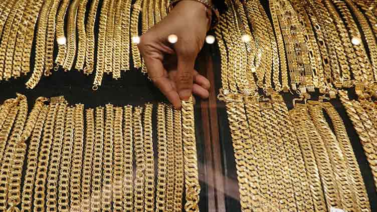 Gold rises as soft dollar, Trump's tariff threats spur safe-haven demand