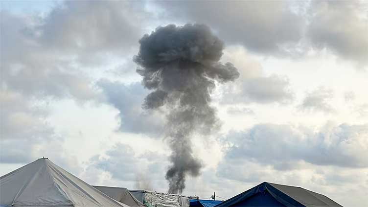 Israel kills 20 Palestinians in airstrikes after agreeing to let some aid into Gaza