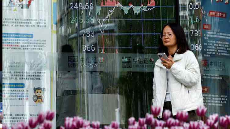 Asian stocks rise as traders weigh US debt, trade deals