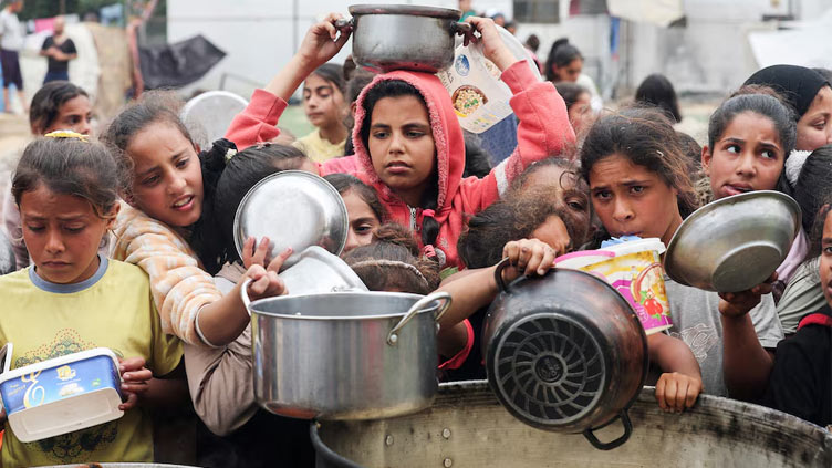 Aid trucks enter Gaza after delays, as pressure mounts on Israel