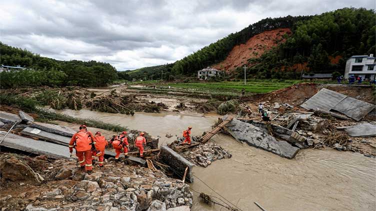 Twenty-one people missing as heavy rains soak southern China, triggering landslides