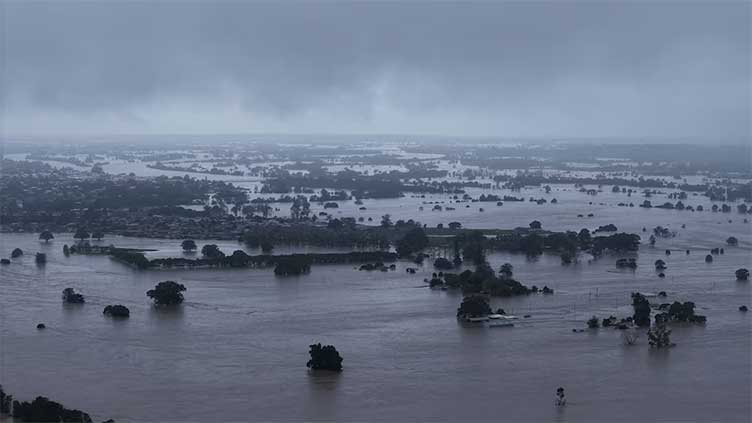 Death toll in Australia floods rises to four, tens of thousands stranded