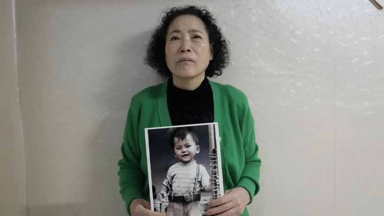 A South Korean mother sues the government and an agency over the adoption of her missing son