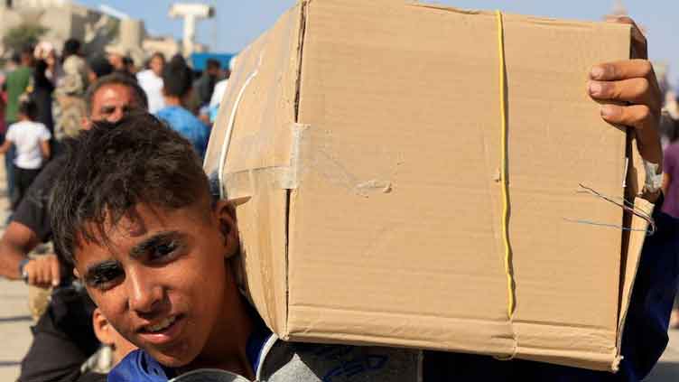 Palestinians storm US-backed aid centres despite concerns over checks