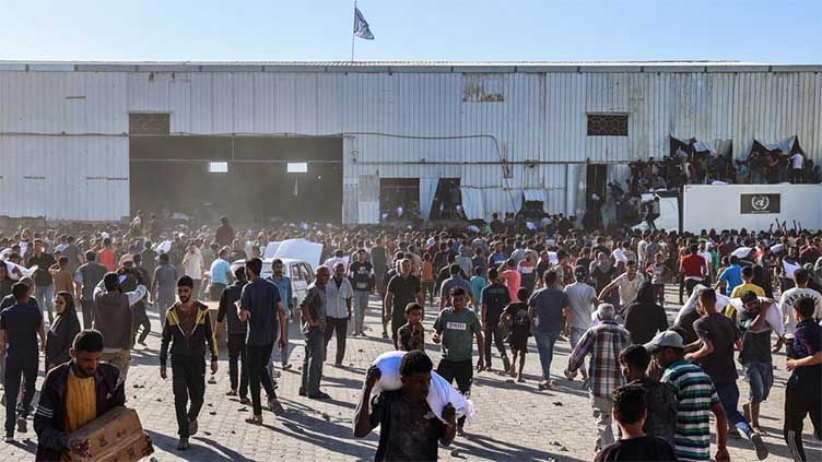 Thousands of Palestinians loot UN warehouse in central Gaza: AFP journalist