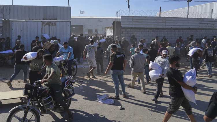 Four Palestinians die in storming of UN food warehouse