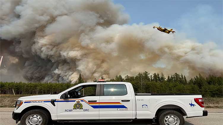 Manitoba urges thousands to evacuate as Canada wildfires spread