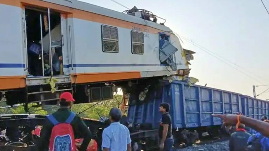 Passenger train collides with cargo train in central India, killing at least 11