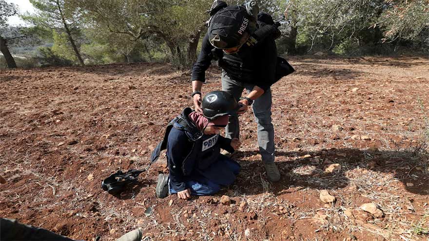 Israeli settlers attack Palestinians, journalists at West Bank olive harvest, witnesses say