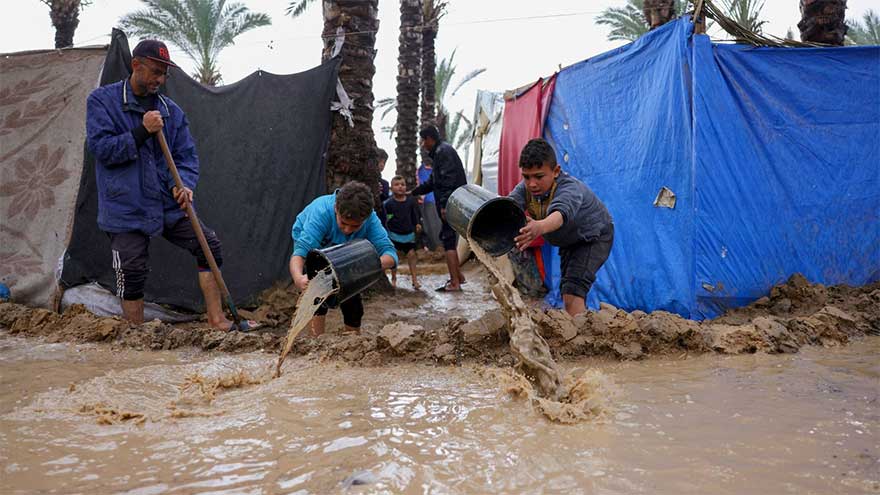 Israel kills at least three in Gaza, as thousands endure heavy flooding