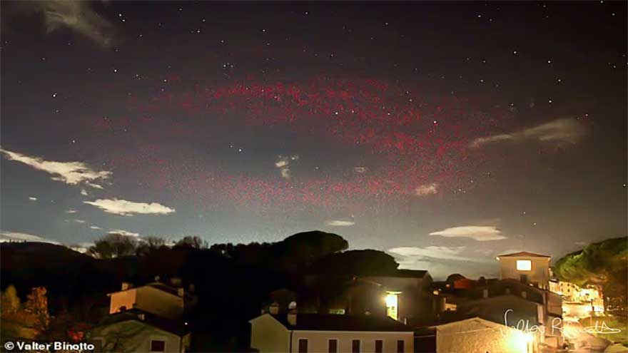 Scientists baffled as mysterious halo of red light appears over Italian town
