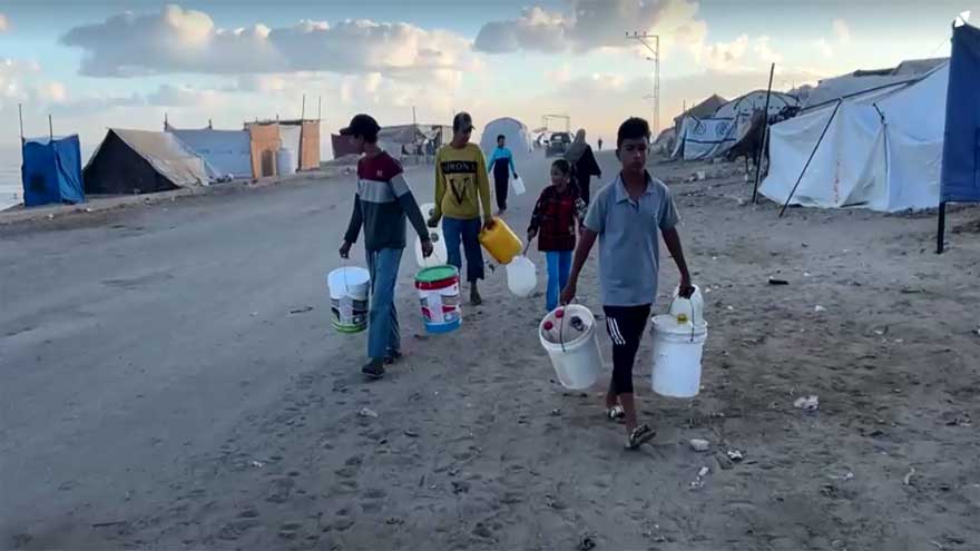 Displaced Palestinians shelter in makeshift roadside tents in central Gaza