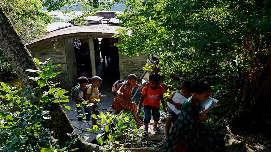 In Bangladesh's flooded plains, schools in boats keep learning afloat