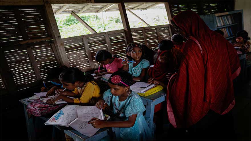 In Bangladesh's flooded plains, schools in boats keep learning afloat