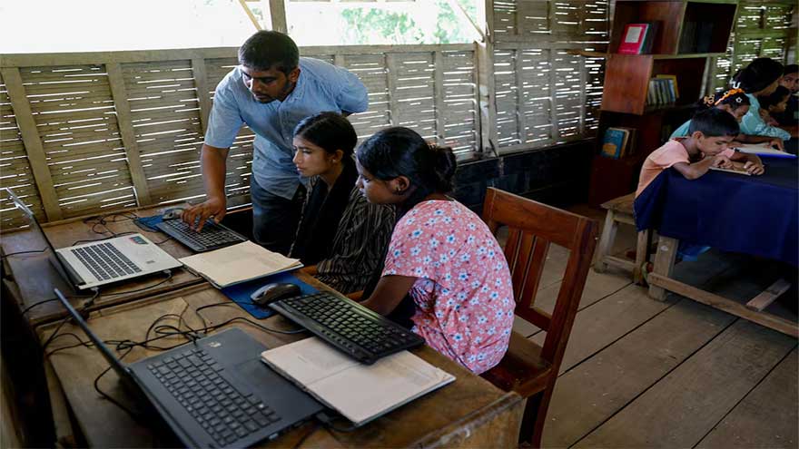 In Bangladesh's flooded plains, schools in boats keep learning afloat