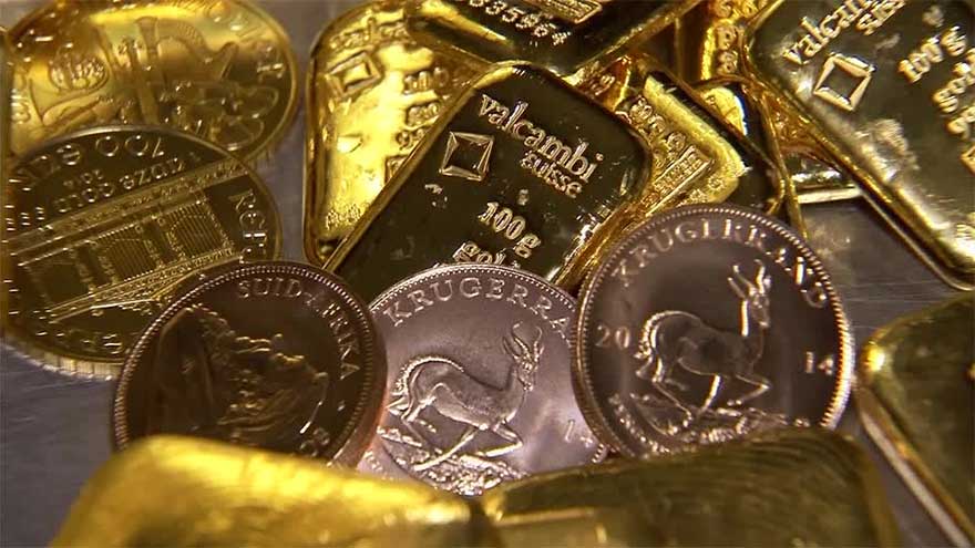 Gold hits record high on safe-haven rush; silver follows suit