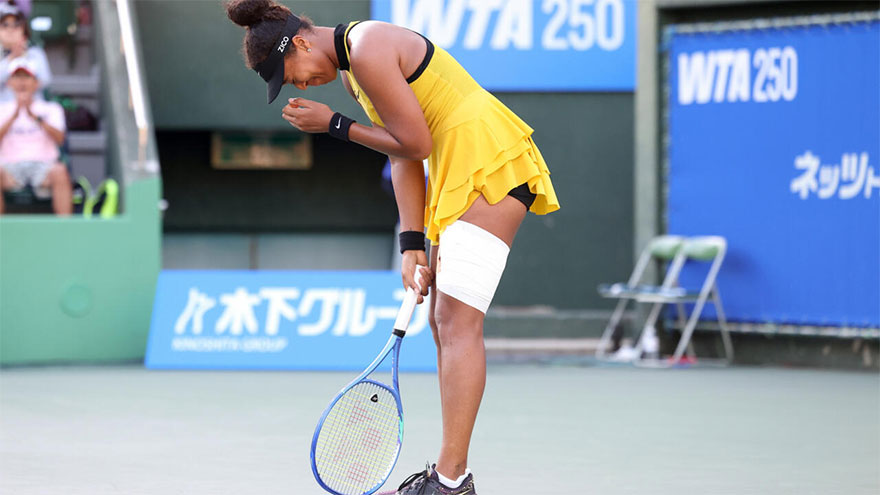 Tearful Osaka battles injury to reach Japan quarter-finals