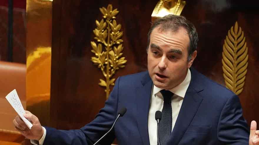 Political crisis in France eases for now as prime minister survives no-confidence vote