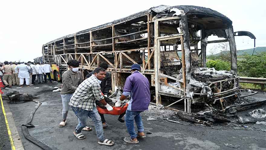 Bus catches fire after being hit by a motorcycle in southern India, killing at least 25