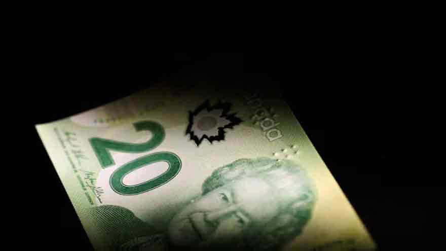 Canadian dollar adds to monthly decline as domestic economy falters