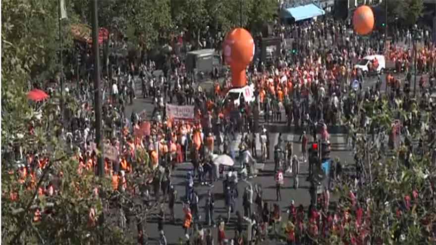 Strikes and protests roil France, pitting the streets against Macron and his new prime minister