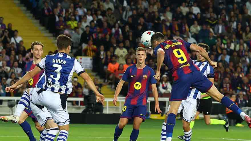 Barcelona go top with 2-1 win over Real Sociedad