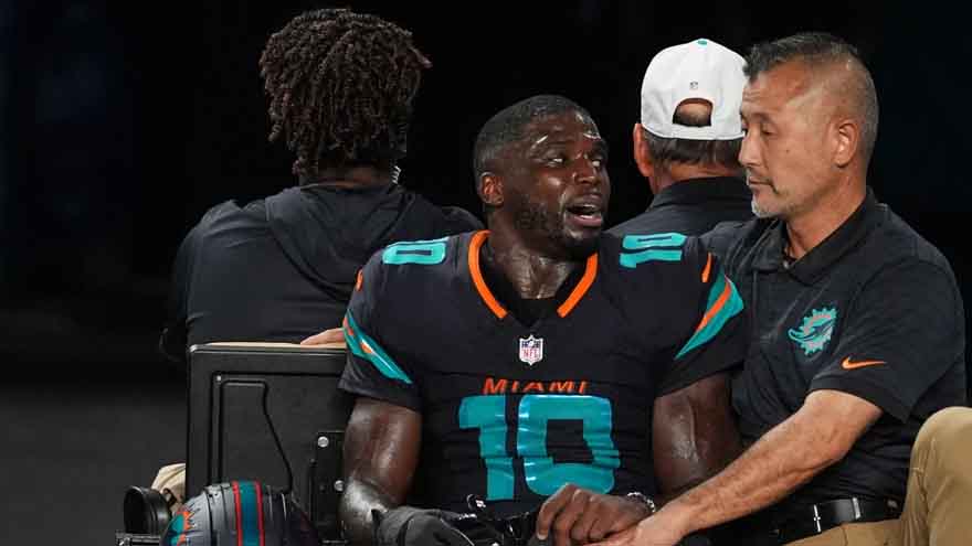 Dolphins' Tyreek Hill carted off field and taken to hospital with dislocated left knee