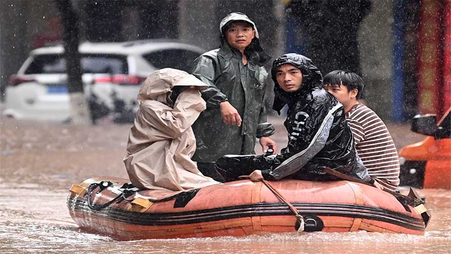 Heavy flooding in southern China forces evacuations and leaves vehicles submerged