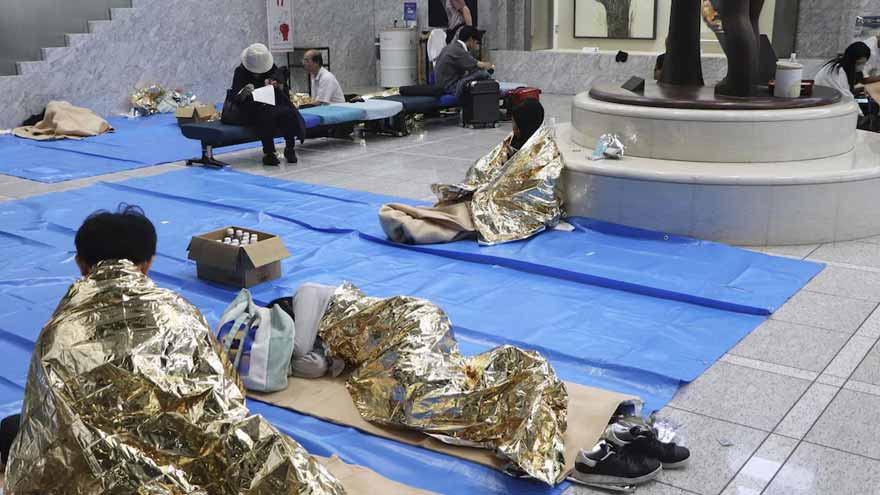 Thousands stranded at Japan's Narita airport after record rain kills four