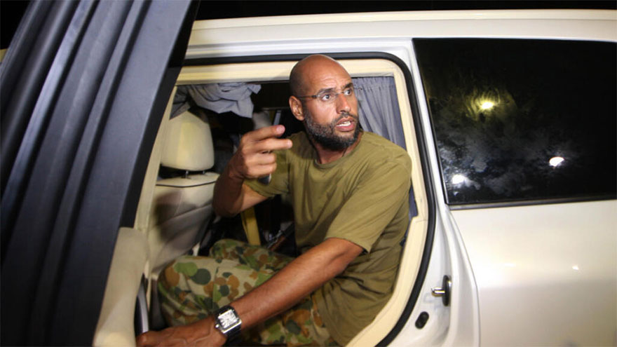 Who is behind the killing of late ruler Gaddafi's son, and why now?