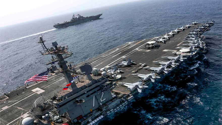 US deploys aircraft carrier as Iran warns against attack