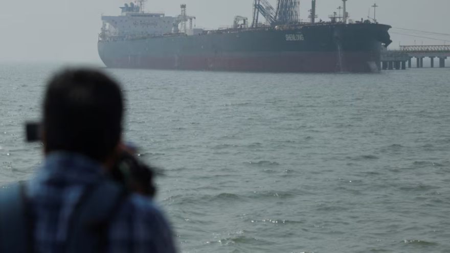 Qatar blames Iran for striking tanker in strait as huge crowds mourn Khamenei