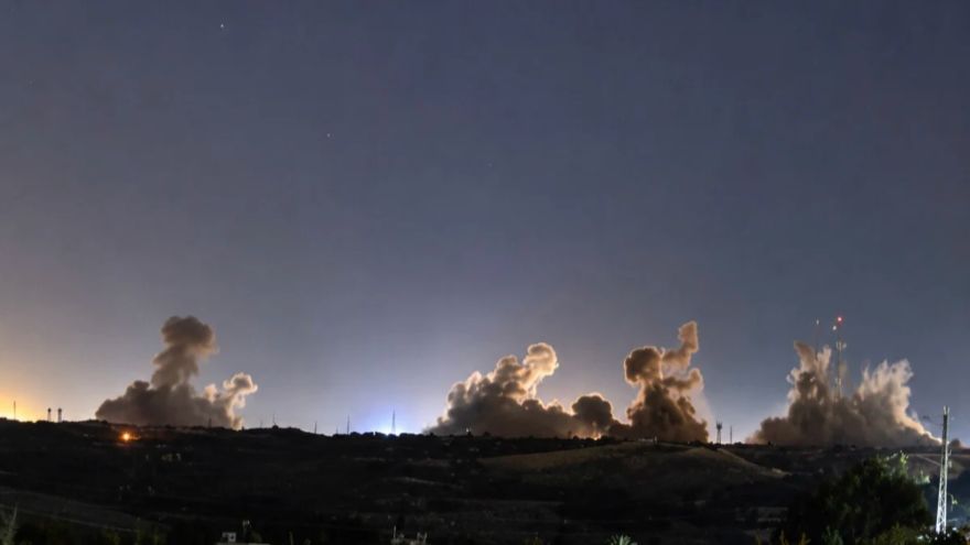 Iran reports new attacks on military targets on its largest island near the Strait of Hormuz