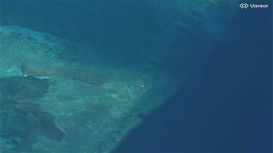 Satellite images show suspected structure at disputed South China Sea atoll, but later gone