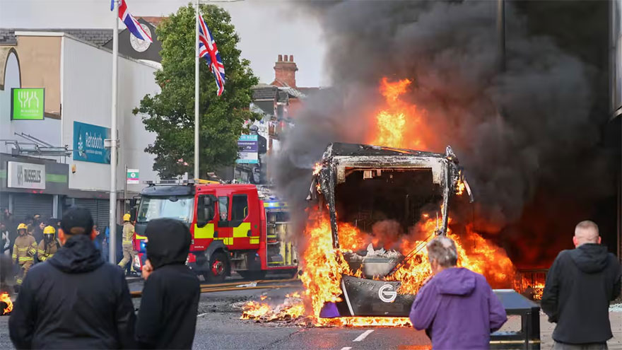 Protesters torch buildings and vehicles, block roads over Belfast stabbing