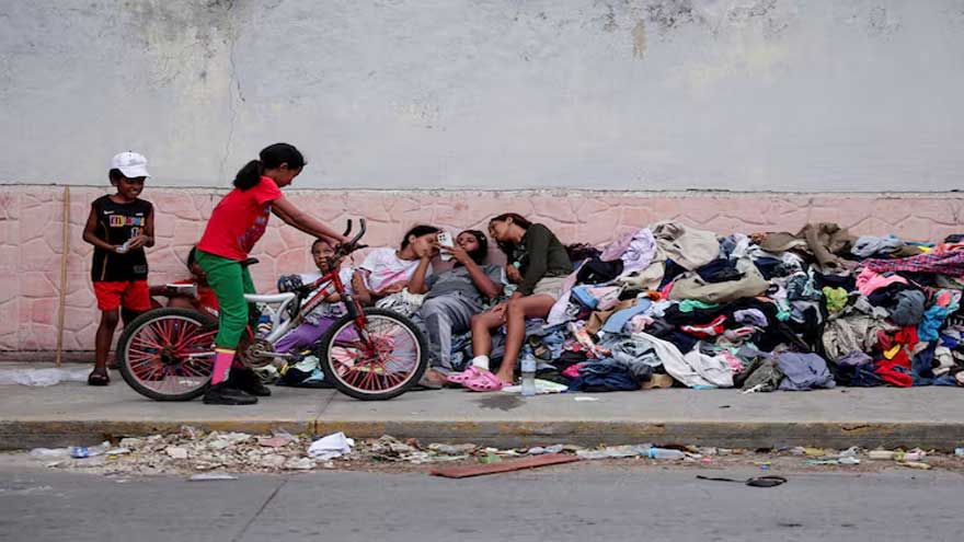 Families of Venezuelans deported from the US and lost in hotel collapse search for loved ones, and for answers