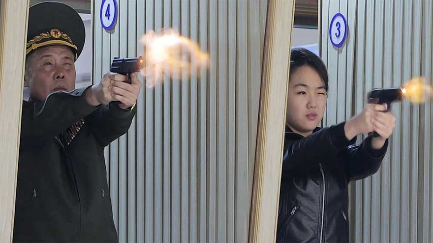North Korean leader Kim and his daughter try out new pistols at shooting range