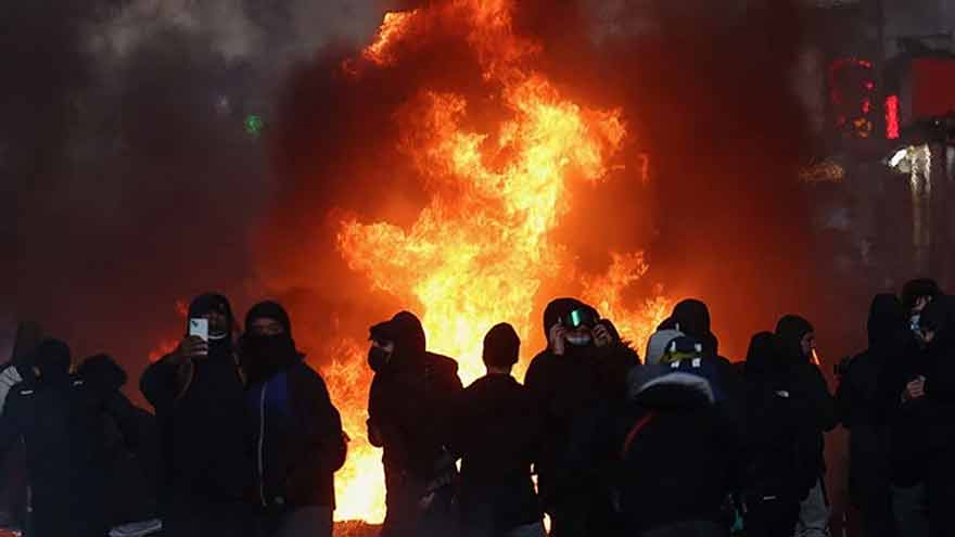 Tensions flare again in Paris as France counts cost of worst unrest in years