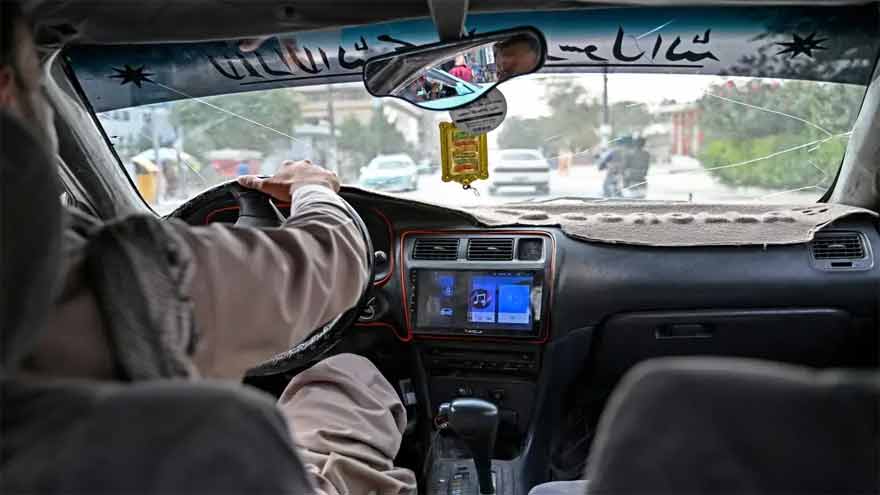 Afghan taxi drivers turn up the music, defying Taliban ban